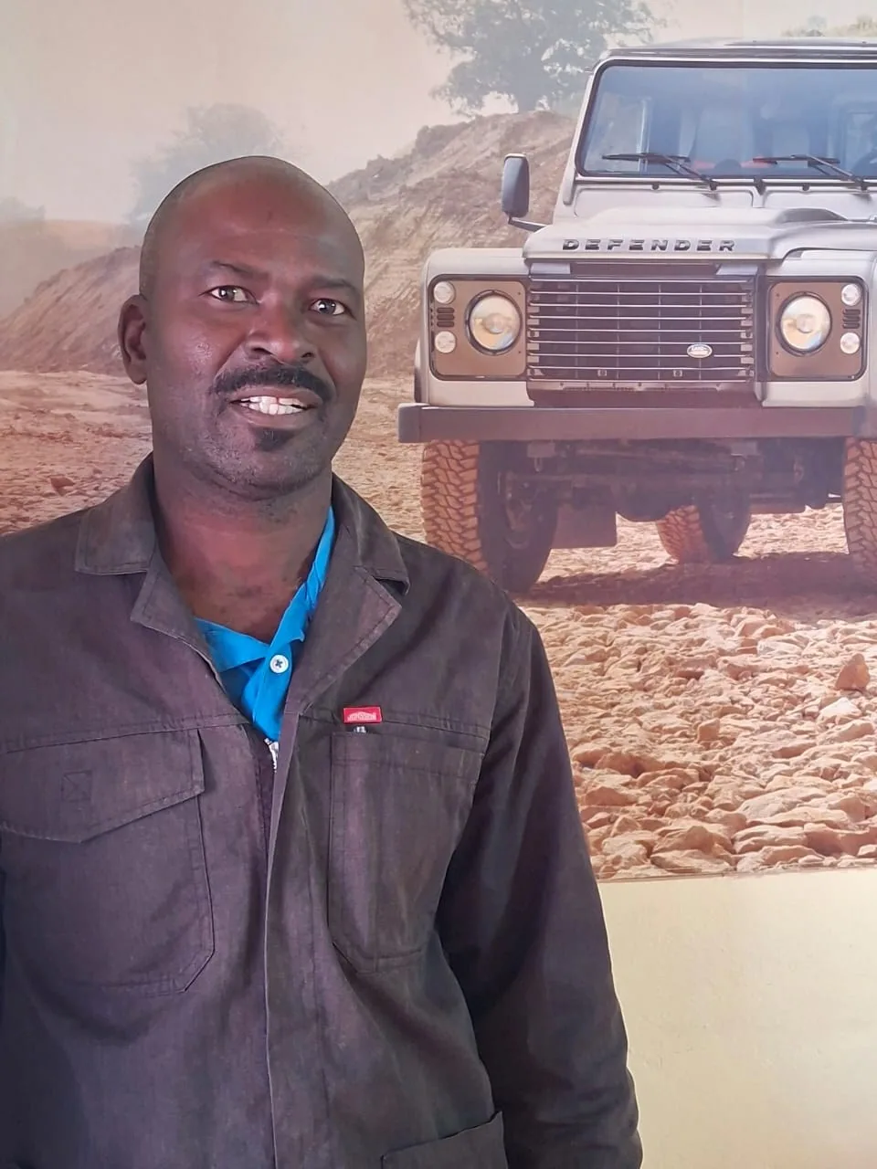 Bonnie, Namvic Safaris workshop mechanic photographed in front of a 4x4 vehicle image
