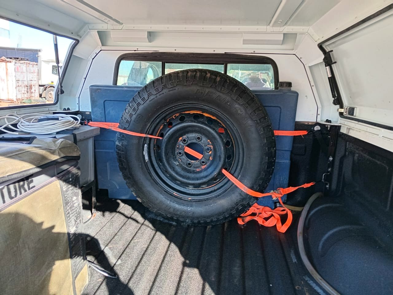 Spare wheel and canopy storage